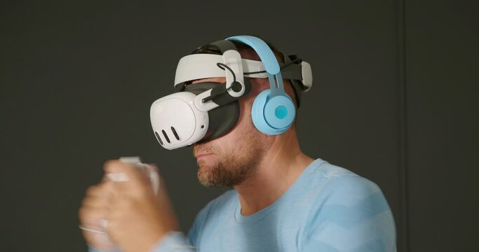 Close-up.Man using Virtual Reality 360 headset, fitness boxing fighting workout.