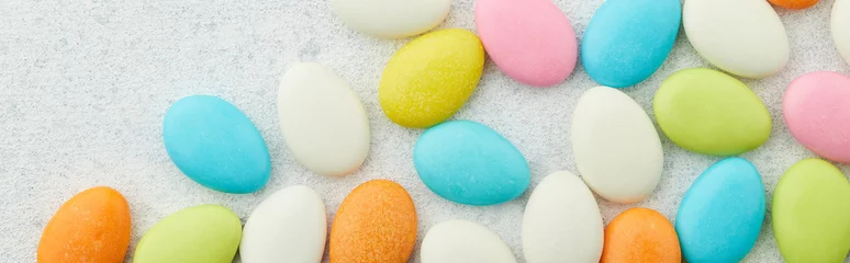 Fotobehang Traditional Easter Portuguese candies. Colorful sweets on grey background © Darya Lavinskaya