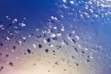 copenhagen, denmark - July 20 2010 : an aerial view of a cloud formation with reflections on the water