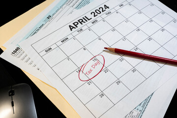 2024 US tax day calendar reminder with tax forms folder and computer mouse.