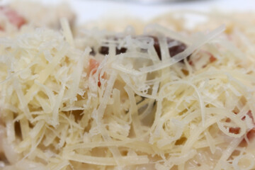 risotto with cheese. meal with grated cheese. meal details. food with selective focus.