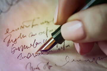 Woman writing letter with fountain pen, closeup