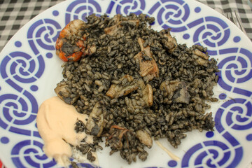 Oceanic Elegance: Black Rice Delight with Calamari and Prawns