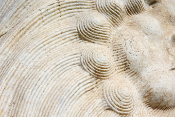 Vintage ornament on the stone. Close-up seamless texture. Stone texture. Embossed pattern.