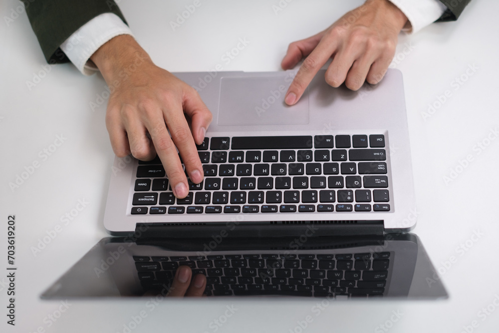 Wall mural businessman's hands are finger point to searching for information. using laptop with your website. d