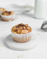 muffins on a white marble tray, homemade bakery style almond muffins on a white background