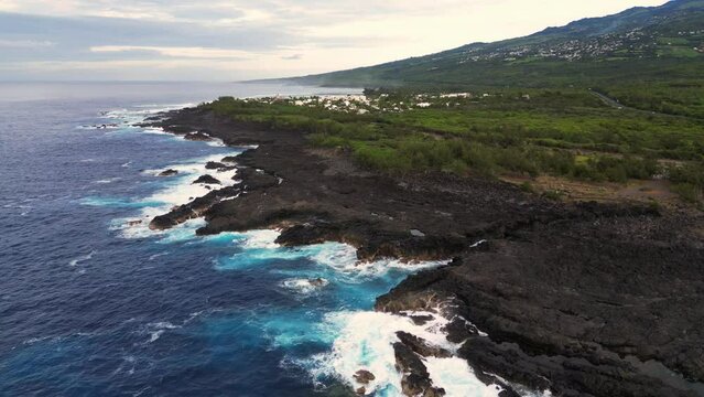Waves on volcanic rocks at Etang Sale at Reunion Island