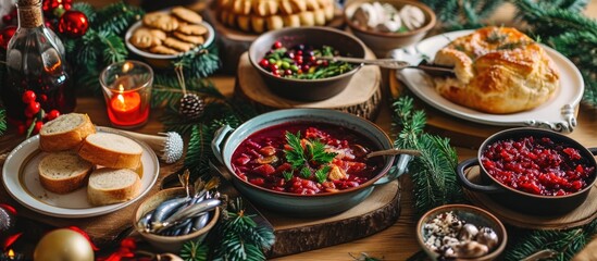 Classic Polish Christmas Eve dishes on festive table- beet soup with dumplings, sauerkraut with...