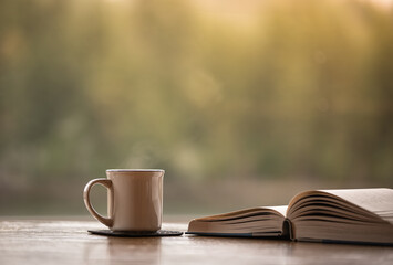 Book coffee or tea on a table, relax and read  at hone concept 