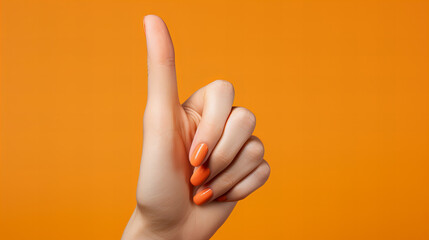 hand with finger up, Woman Hand with isolated on orange background, Close up of white woman hand, Female hand showing sign OK, copy space