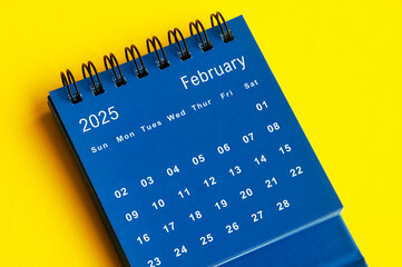 2023 blue desk calendar on yellow cover background.