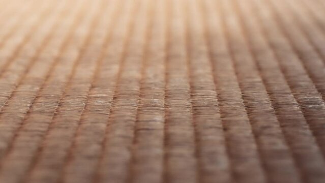 Close up of the traditional Japanese tatami mat on the floor of the house. Slow motion. 