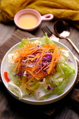 garden salad. romaine lettuce, shaved carrots, purple cabbage, cucumber. olive oil dressing.