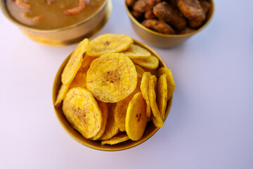 Kerala banana chips popular deep fried snack traditional South Indian tea time snack on banana leaf, Kerala India. made in coconut oil on Onam, Vishu, Diwali Deepawali, Ramzan, Eid India Sri lanka
