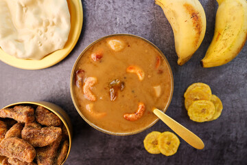 Parippu Payasam Pradhaman or Moong Dal Kheer Indian sweet Kerala food for Onam festival special dessert Mithai for Onam sadya , sadhya in green banana leaf background. Also popular Sri Lankan food .