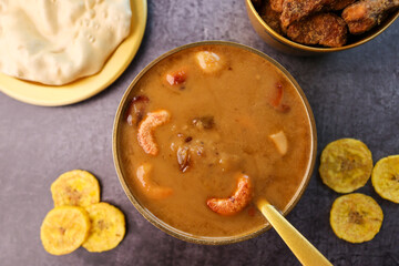 Parippu Payasam Pradhaman or Moong Dal Kheer Indian sweet Kerala food for Onam festival special dessert Mithai for Onam sadya , sadhya in green banana leaf background. Also popular Sri Lankan food .