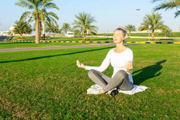 woman doing yoga fitness and yoga park practice in the morning for wellness