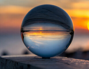 A sphere with a sunset in the background