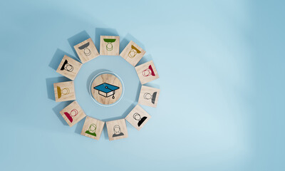 Male and female student icons on wooden blocks. Education concept for success.