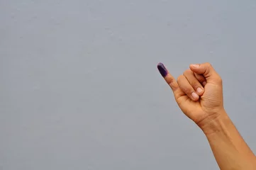 Poster little finger after voting on Indonesia's presidential election © Abu