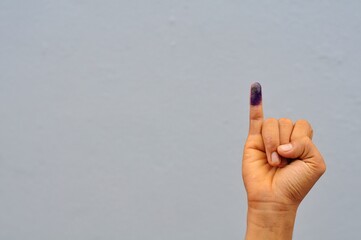 little finger after voting on Indonesia's presidential election