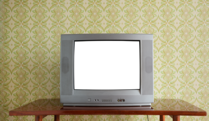 An old TV with a white screen on the bedside table against the background of wallpaper.