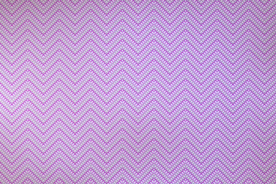 Rough and purple-colored textile fabric. Khadi pattern. Fabric pattern. Textile pattern.