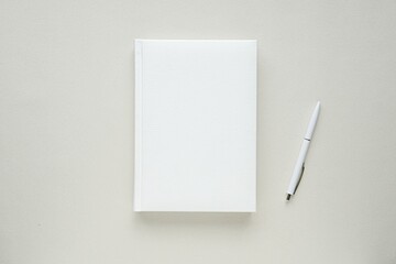 Blank book with hard cover mockup, white notebook, diary, calendar or planner, minimal flat lay...