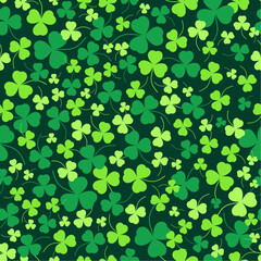 A green field of shamrocks of different colors. Seamless vector pattern. St. Patrick's Day. Lucky clover.