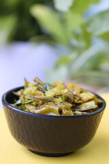 Masala flat green beans, onions, and curry spices, pan fried