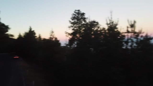 drone shot sunset sunrise over mountain range valley