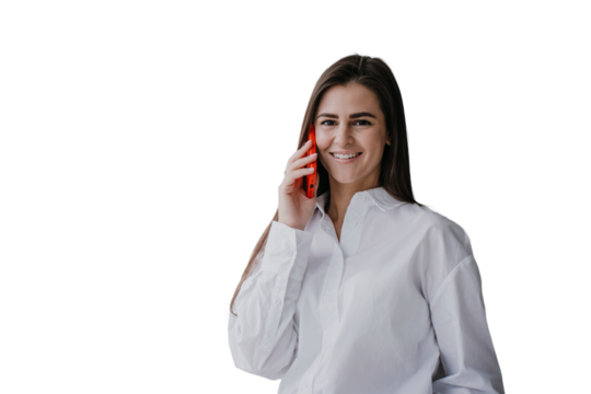 Cheerful brunette hispanic young businesswoman talking by phone against transparent background, great news. Pretty caucasian girl  using cell phone looks happily at camera. Successful female.