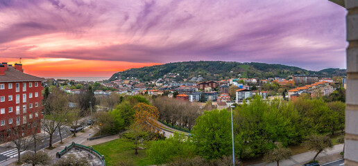 Panoramic sunset in Donostia San Sebastian from a high neighborhood and the sea in the background....
