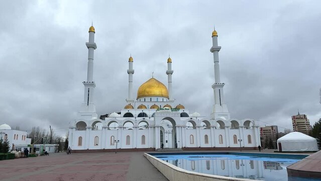 Astana, Kasakhstan, beautiful gold and white Nur-Astana mosque is one of the biggest in Central Asia. The name of the mosque Abu Nasir al-Farabi Mosque is written over the entrance in kazakh language.