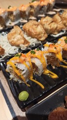Close up of Sushi in black plastic box, Japanese food. sushi rolls with salmon and shrimp
