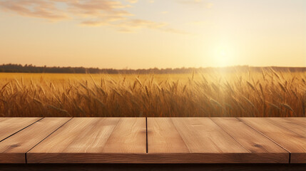 wood board table in front of field of wheat on beautiful sunset