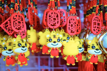Front view close up of colourful decorations for sale in shop before the festive Lunar New Year....