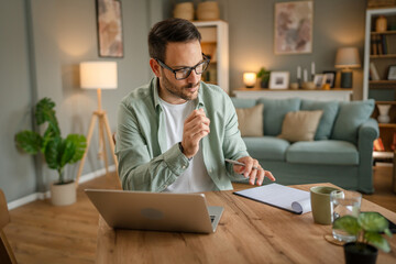 one man adult caucasian work on laptop at home happy smile