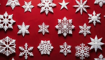 Naklejka na ściany i meble a bunch of white snowflakes are on a red background with white snowflakes in the shape of snowflakes on a red background with white snowflakes in the shape of snowflakes.