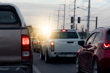 Rear side of pickup car with turn on brake light on asphalt roads. During rush hours for travel or...