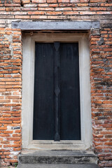 Old wooden door on Red Brick Wall.