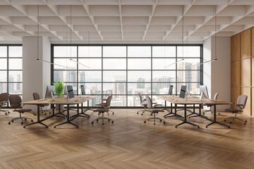 Fototapeta premium Stylish office interior with chairs, pc computers and table in row near window