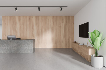 Stylish modern office reception interior stone desk and sideboard with tv screen
