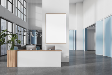 White and blue office interior with reception and poster