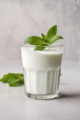 Ayran drink in glass on the light grey background
