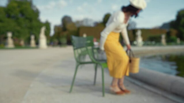 Attractive young girl in Tuileries park in summer in Paris