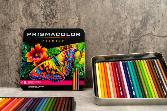 Burriana, Spain 12-30-2023: Product image of a metal box of colored pencils from the Prismacolor brand on a gray background