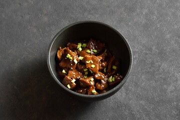Beef with soy sauce, green onion and sesame seeds