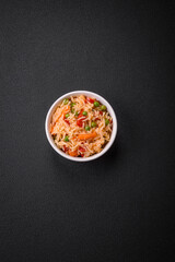 Delicious boiled rice with vegetables peppers, green peas, salt, spices and herbs