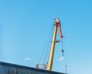 Fototapeta na wymiar boom shipbuilding cranes on a background of blue sky, natural light.